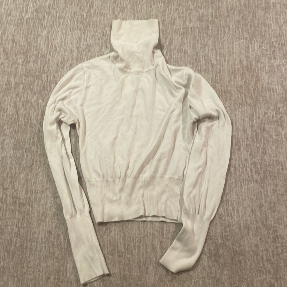 Large turtle neck sweater.